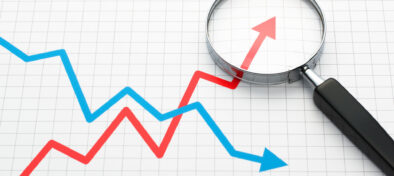 graph line trend analytics magnifying glass